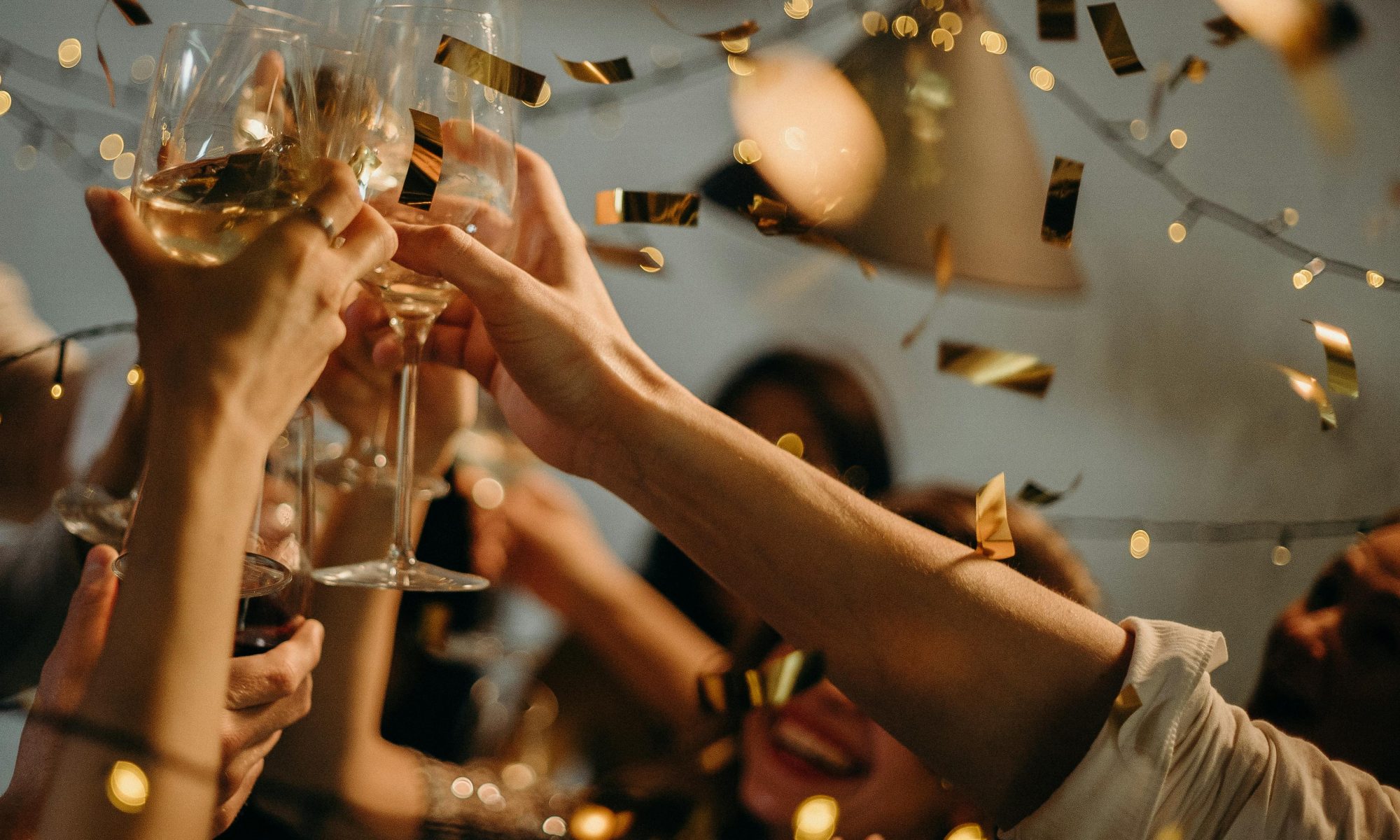 Confetti falls around a celebratory champagne toast